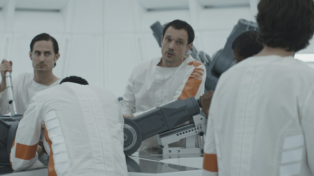 Cassian and his fellow inmates work piecework to craft heavy machine parts for the Empire.