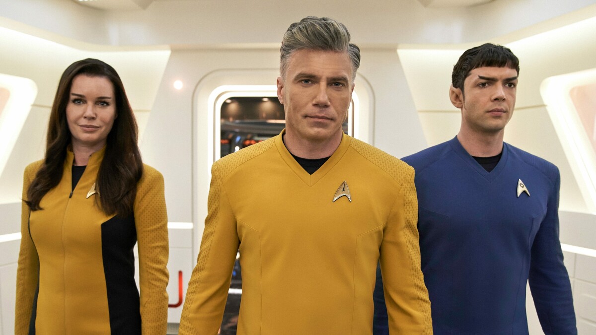 Star Trek Strange New Worlds: Captain Pike (Anson Mount) with Una (Rebecca Romijn) and Spock (Ethan Peck).