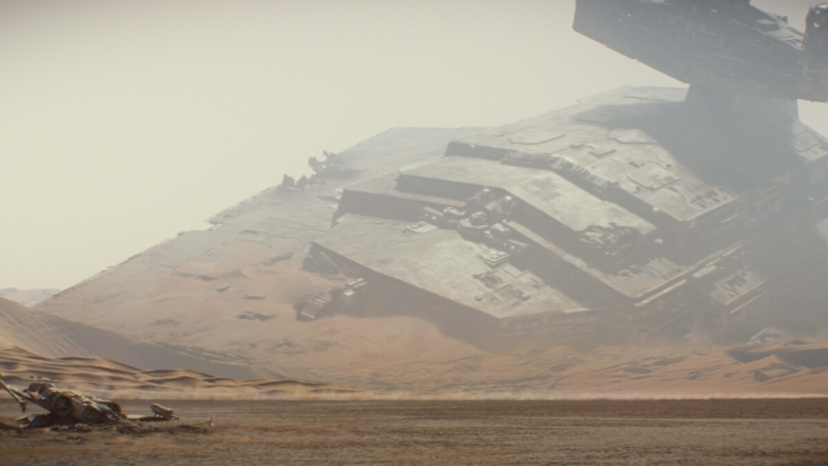Scene from Star Wars - The Force Awakens: A wrecked Star Destroyer lies in the background. 