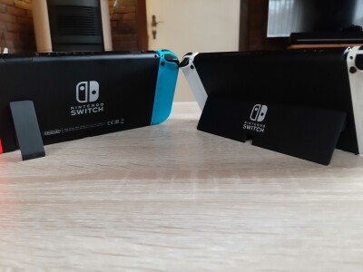 The Switch's stand is just a narrow strip, while the OLED model's stand extends almost across the entire back of the display.