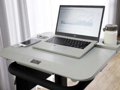 The Acer desk features multiple USB ports and a cup holder.